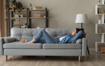 Side,View,Woman,Enjoy,Day,Nap,On,Comfy,Sofa.,Young