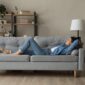 Side,View,Woman,Enjoy,Day,Nap,On,Comfy,Sofa.,Young